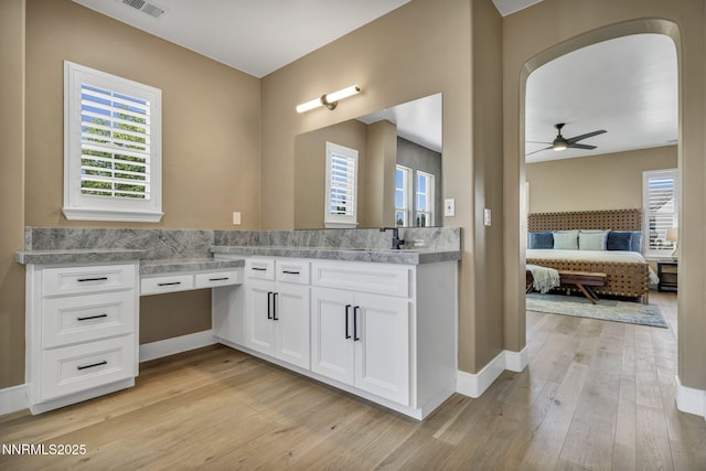2965 Roundrock Ct, Reno, NV 89511 - full bathroom featuring ensuite bathroom, a ceiling fan, wood-type flooring, and plenty of natural light