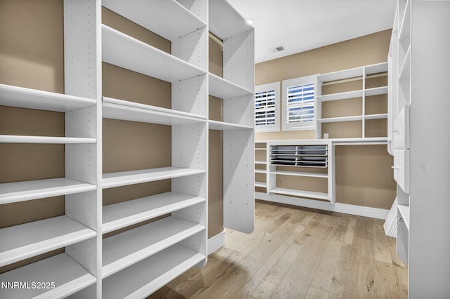 2965 Roundrock Ct, Reno, NV 89511 - walk in closet featuring wood finished floors