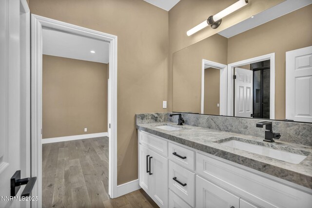2965 Roundrock Ct, Reno, NV 89511 - full bathroom with baseboards, wood finished floors, and double vanity