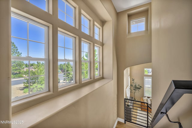 2965 Roundrock Ct, Reno, NV 89511 - stairs with a towering ceiling, healthy amount of natural light, baseboards, and wood finished floors