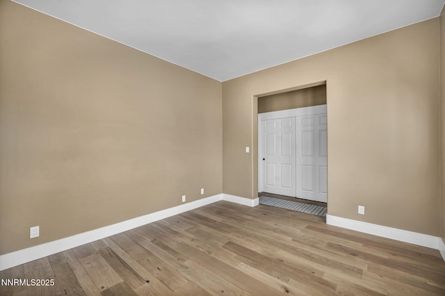 2965 Roundrock Ct, Reno, NV 89511 - unfurnished bedroom with baseboards, wood finished floors, and a closet