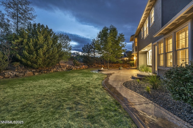2965 Roundrock Ct, Reno, NV 89511 - view of grassy yard featuring a patio area