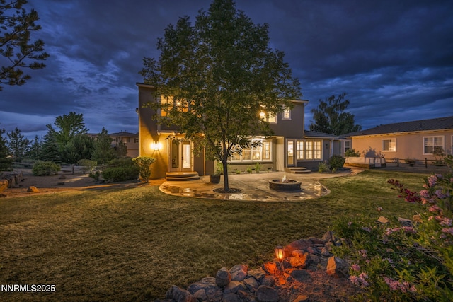 2965 Roundrock Ct, Reno, NV 89511 - back of property featuring an outdoor fire pit, a yard, and stucco siding