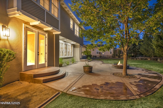 2965 Roundrock Ct, Reno, NV 89511 - view of patio / terrace with french doors and an outdoor fire pit