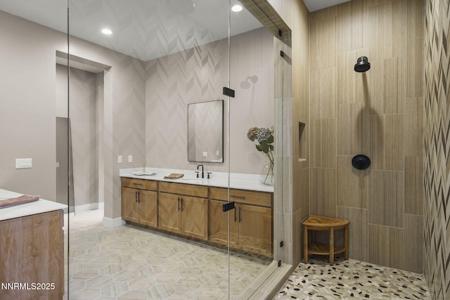 9129 Wild Skies Way, Reno, NV 89523 - bathroom featuring a tile shower, vanity, recessed lighting, and baseboards