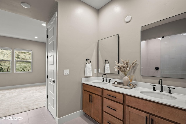 9129 Wild Skies Way, Reno, NV 89523 - bathroom with double vanity, tile patterned floors, baseboards, and recessed lighting