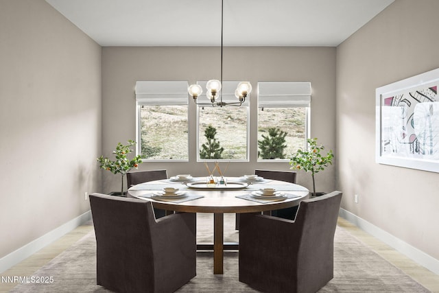 9129 Wild Skies Way, Reno, NV 89523 - dining space with plenty of natural light, a chandelier, baseboards, and wood finished floors