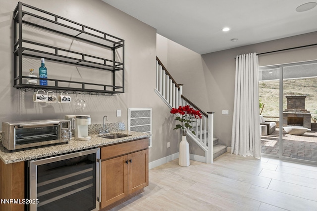 9129 Wild Skies Way, Reno, NV 89523 - indoor wet bar with wine cooler, stairway, baseboards, and recessed lighting