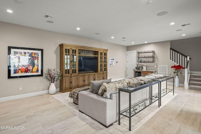 9129 Wild Skies Way, Reno, NV 89523 - living room with stairway, recessed lighting, baseboards, and wine cooler