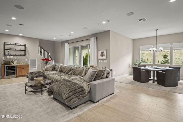 9129 Wild Skies Way, Reno, NV 89523 - living area with wine cooler, plenty of natural light, recessed lighting, a chandelier, and bar area