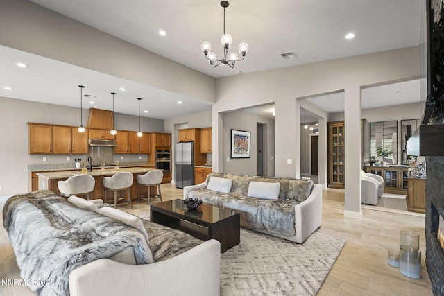 9129 Wild Skies Way, Reno, NV 89523 - living room featuring recessed lighting and a chandelier