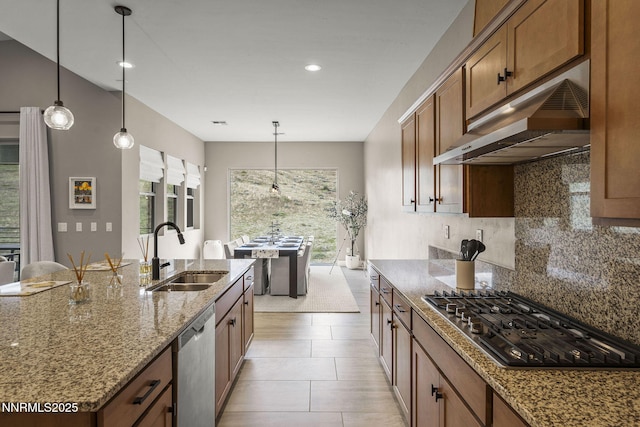 9129 Wild Skies Way, Reno, NV 89523 - kitchen with a sink, under cabinet range hood, appliances with stainless steel finishes, backsplash, and stone countertops