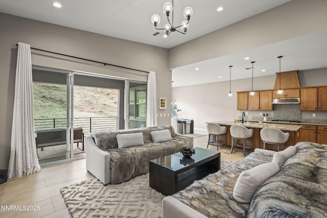 9129 Wild Skies Way, Reno, NV 89523 - living area with a chandelier and recessed lighting