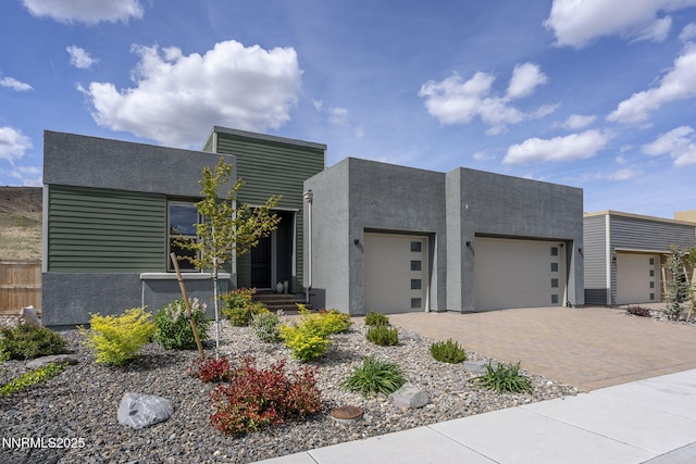 9129 Wild Skies Way, Reno, NV 89523 - contemporary home featuring a garage, driveway, and stucco siding