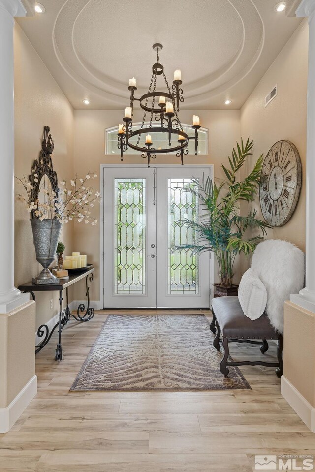 5330 Ventana Pkwy, Reno, NV 89511 - foyer entrance featuring a chandelier, a raised ceiling, french doors, wood finished floors, and recessed lighting