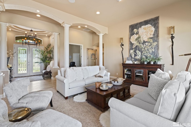 5330 Ventana Pkwy, Reno, NV 89511 - living room with ornate columns, recessed lighting, arched walkways, and a chandelier