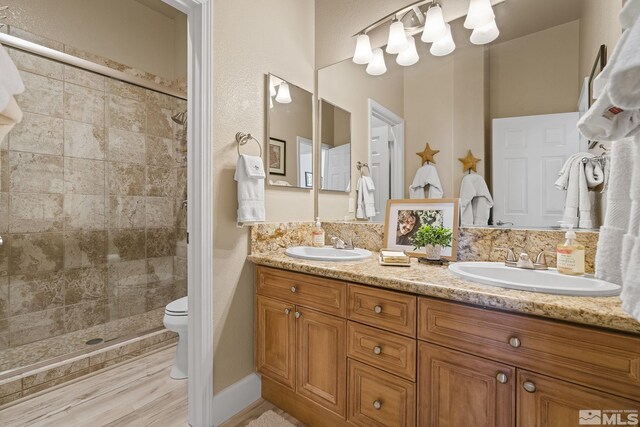5330 Ventana Pkwy, Reno, NV 89511 - full bath featuring tiled shower, toilet, and double vanity