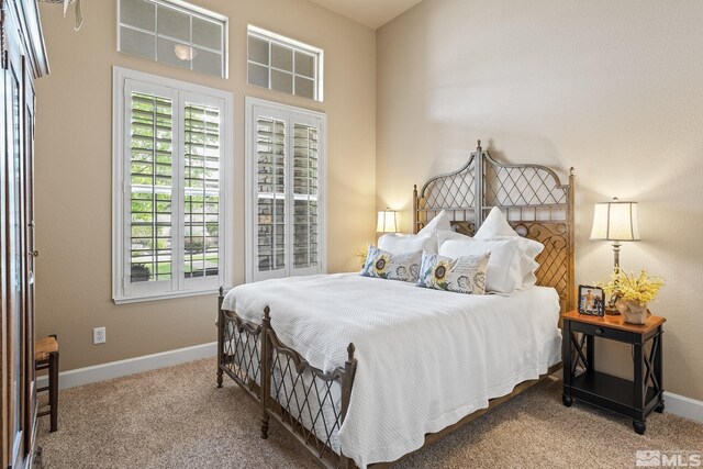 5330 Ventana Pkwy, Reno, NV 89511 - bedroom featuring carpet floors, multiple windows, and baseboards