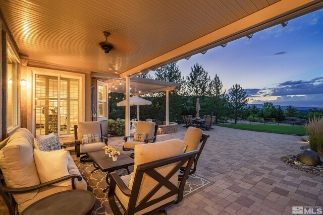 5330 Ventana Pkwy, Reno, NV 89511 - patio terrace at dusk with outdoor dining area, an outdoor hangout area, and a patio