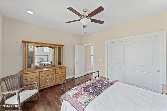 1004 Keystone Ct, Gardnerville, NV 89460 - bedroom featuring dark wood-style floors, a closet, baseboards, and a ceiling fan