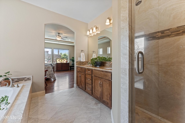 1004 Keystone Ct, Gardnerville, NV 89460 - full bath with double vanity, a bath, a shower stall, and ceiling fan