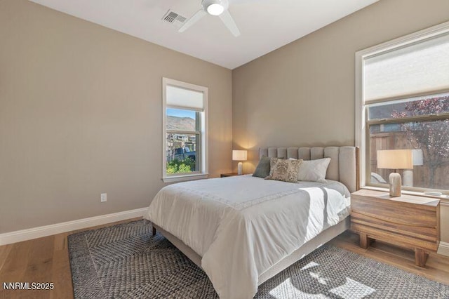 9220 Wild Skies Ct, Reno, NV 89523 - bedroom with wood finished floors, baseboards, and a ceiling fan