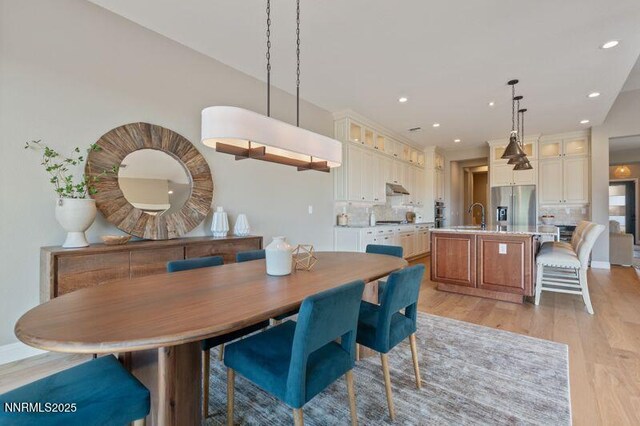9220 Wild Skies Ct, Reno, NV 89523 - dining space with light wood-type flooring and recessed lighting