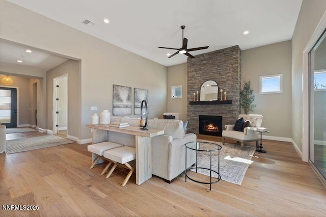 9220 Wild Skies Ct, Reno, NV 89523 - living area featuring ceiling fan, light wood finished floors, baseboards, a fireplace, and recessed lighting