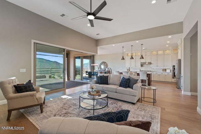 9220 Wild Skies Ct, Reno, NV 89523 - living area with ceiling fan, recessed lighting, light wood-style flooring, and baseboards