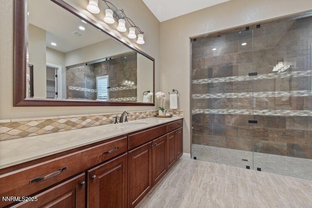 9220 Wild Skies Ct, Reno, NV 89523 - full bathroom with vanity, decorative backsplash, and tiled shower