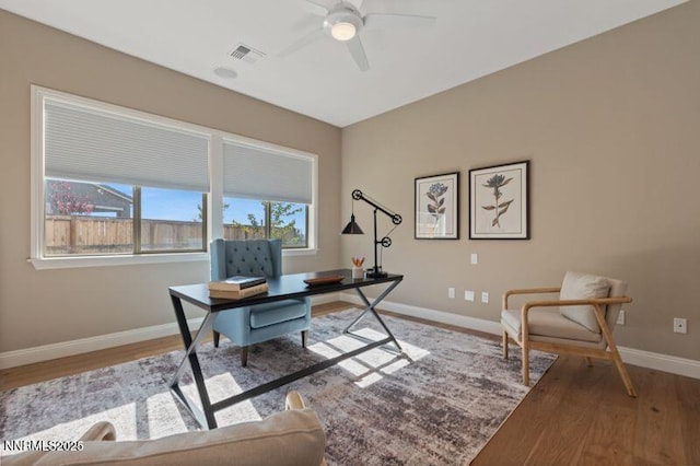 9220 Wild Skies Ct, Reno, NV 89523 - home office with wood finished floors, ceiling fan, and baseboards