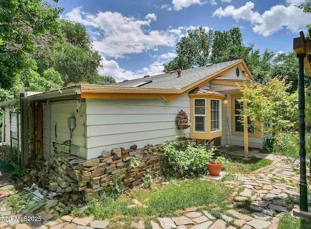 1303 N Division St, Carson City, NV 89703 - view of side of home featuring a shingled roof