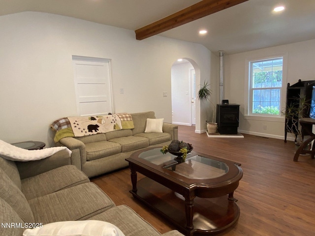 1303 N Division St, Carson City, NV 89703 - living room with a wood stove, arched walkways, wood finished floors, recessed lighting, and beamed ceiling