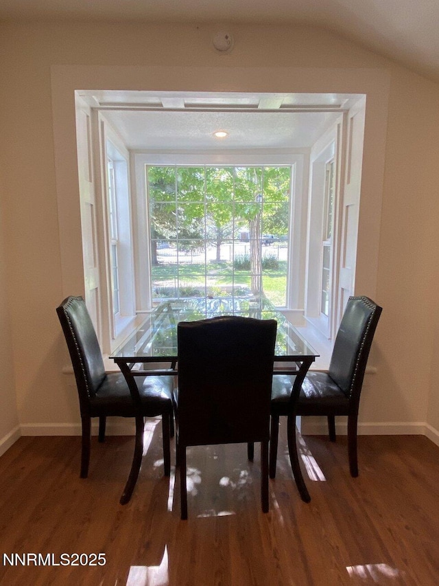 1303 N Division St, Carson City, NV 89703 - dining room featuring wood finished floors, baseboards, and vaulted ceiling