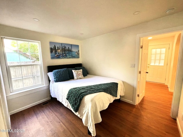 1303 N Division St, Carson City, NV 89703 - bedroom with baseboards, wood finished floors, and recessed lighting