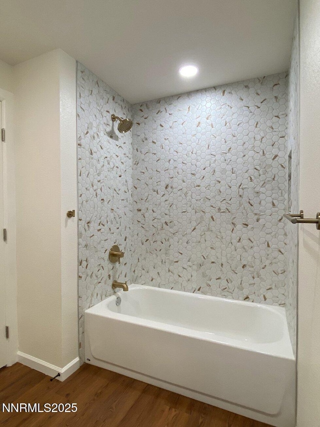 1303 N Division St, Carson City, NV 89703 - full bathroom featuring wood finished floors, shower / bathtub combination, and baseboards