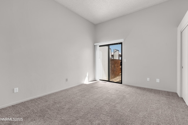 1970 Sierra Highlands Dr, Reno, NV 89523 - empty room featuring carpet flooring, a textured ceiling, baseboards, and lofted ceiling