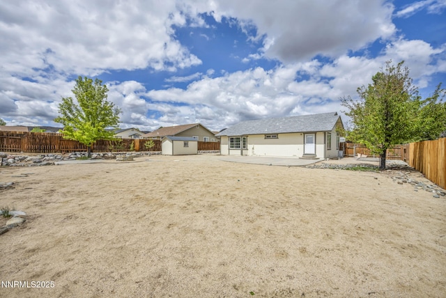 1458 Rosy Finch Dr, Sparks, NV 89441 - back of property with a patio area, a fenced backyard, and stucco siding