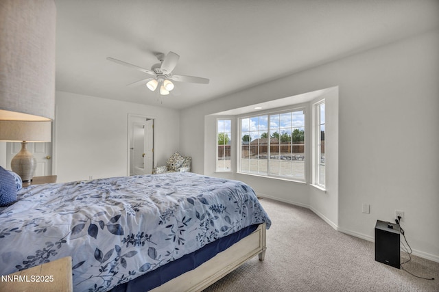 1458 Rosy Finch Dr, Sparks, NV 89441 - bedroom with carpet flooring, baseboards, ceiling fan, and connected bathroom