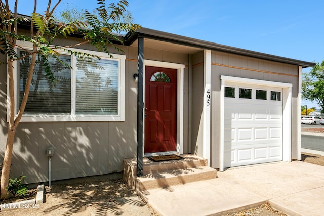 495 Margrave Dr, Reno, NV 89502 - property entrance featuring an attached garage and driveway