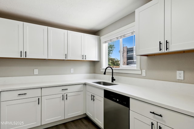 495 Margrave Dr, Reno, NV 89502 - kitchen featuring stainless steel dishwasher, a sink, light countertops, and white cabinets