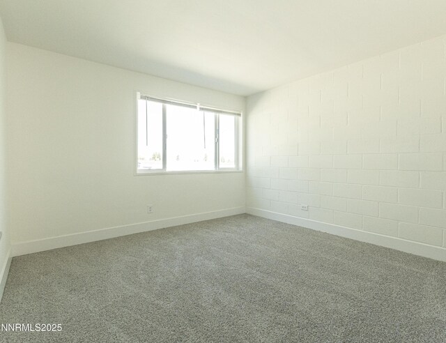 12101 Green Mountain St, Reno, NV 89506 - carpeted empty room featuring baseboards and concrete block wall