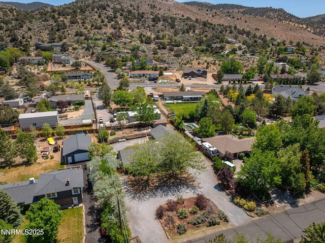 14690 Rancheros Dr, Reno, NV 89521 - aerial overview of property's location with nearby suburban area and a mountainous background