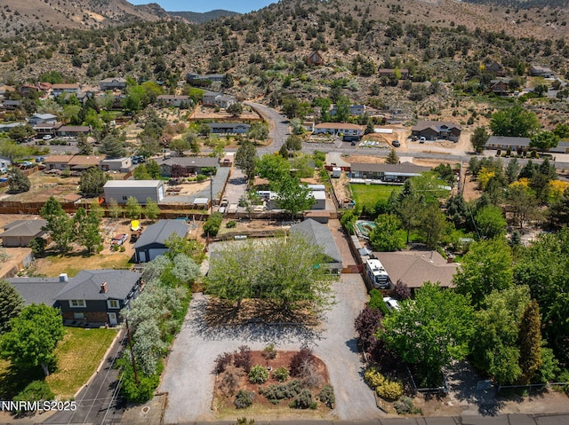 14690 Rancheros Dr, Reno, NV 89521 - aerial overview of property's location with nearby suburban area and a mountainous background