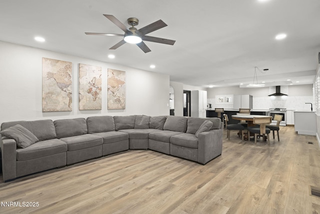 14690 Rancheros Dr, Reno, NV 89521 - living room featuring recessed lighting, light wood-style flooring, and a ceiling fan