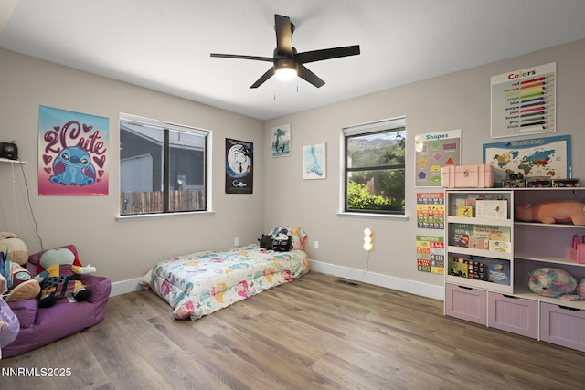 14690 Rancheros Dr, Reno, NV 89521 - bedroom featuring wood finished floors, baseboards, and a ceiling fan