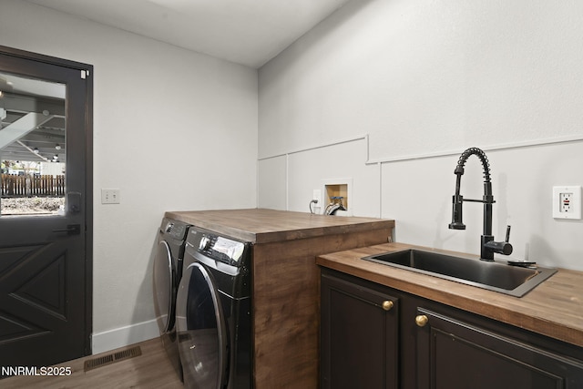 14690 Rancheros Dr, Reno, NV 89521 - laundry area with washer and dryer, dark wood-style floors, baseboards, and cabinet space