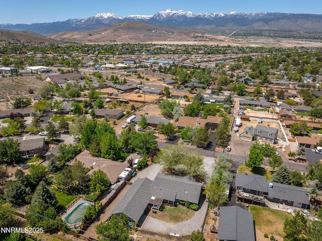 14690 Rancheros Dr, Reno, NV 89521 - aerial view of property and surrounding area with a mountainous background and nearby suburban area