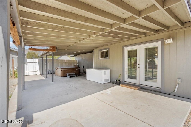 1235 Koontz Ln, Carson City, NV 89701 - view of patio / terrace featuring a hot tub, french doors, and a gate