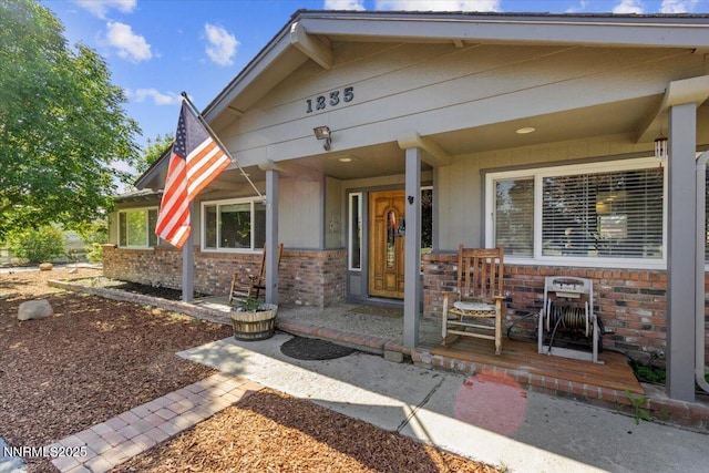 1235 Koontz Ln, Carson City, NV 89701 - property entrance featuring a porch and brick siding